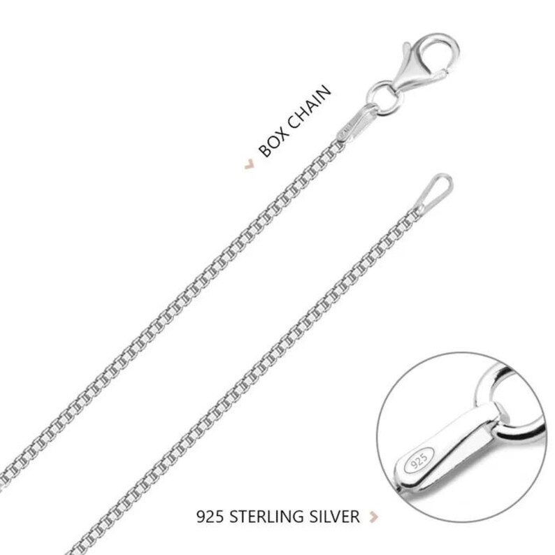 May include: A silver box chain necklace with a lobster clasp and a 925 sterling silver stamp. The chain is made of small, square links.