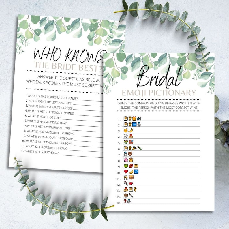 May include: A white ceramic mug with a black handle and the text "But First, Coffee" in a bold, black font. The mug is set against a blurred background, suggesting a cozy setting.