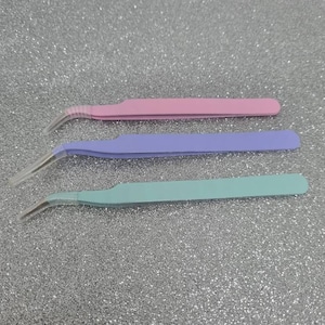 Angled metal tweezers image 1