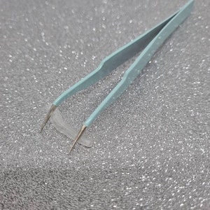 Angled metal tweezers image 2