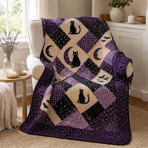 May include: A patchwork quilt featuring a repeating pattern of black cats, crescent moons, and bats. The quilt is constructed from squares in shades of purple, black, and cream, with a decorative border and intricate stitching throughout the fabric.
