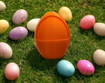 May include: A collection of colourful Easter eggs, including pink, purple, blue, yellow, and white, with a single orange egg in the centre. The eggs are scattered on a bed of green grass.