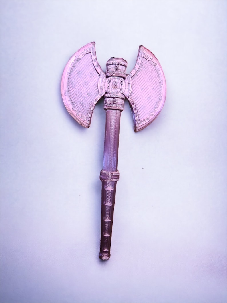 May include: A pink plastic toy axe with a double-headed blade and a detailed handle.