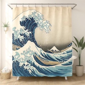 May include: A shower curtain featuring a classic Japanese woodblock print of a large ocean wave. The artwork depicts a dynamic scene with a towering blue wave, boats, and a distant mountain against a neutral background. The curtain is designed to hang from a shower rod.