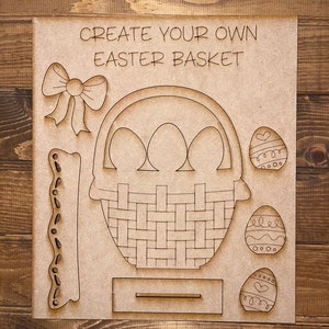May include: A wooden craft kit for creating an Easter basket. The kit includes a basket, three eggs, a bow, and a handle. The text "CREATE YOUR OWN EASTER BASKET" is printed on the wood.