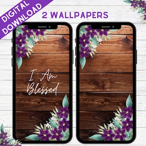 May include: Two phone wallpapers with a woodgrain background and purple flowers in the corners. One wallpaper has the text "I Am Blessed" in white.