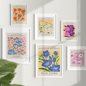 Puede incluir: Seis impresiones enmarcadas con ilustraciones florales y el texto "Collection Botanique Flower Market" sobre cada imagen. Las ciudades de Madrid, Londres, Par&iacute;s, Nueva York, Sydney y San Francisco se enumeran debajo de cada imagen.
