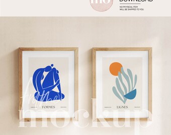 Puede incluir: Dos impresiones enmarcadas con arte abstracto. La impresión de la izquierda presenta una figura azul en posición sentada. La impresión de la derecha presenta un diseño abstracto azul y verde con un círculo naranja. Las impresiones están etiquetadas como "FORMES" y "LIGNES".