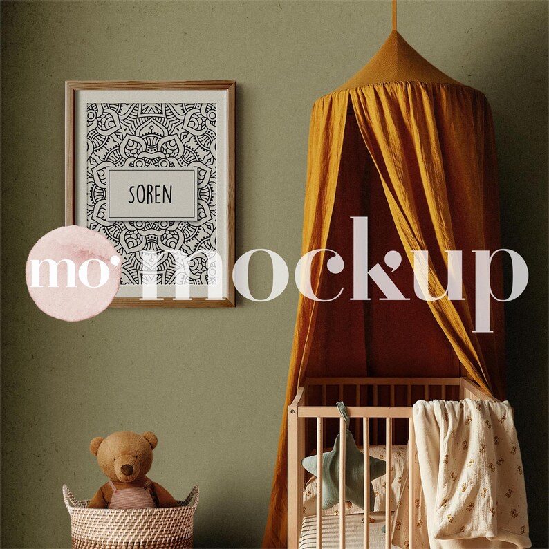 May include: A yellow canopy crib tent with a wooden crib inside. The crib has a white and brown striped mattress, a green star-shaped pillow, and a white blanket with a brown floral pattern. A framed black and white mandala print with the word "Soren" inside hangs on the wall behind the crib. A brown teddy bear sits in a wicker basket in the foreground.