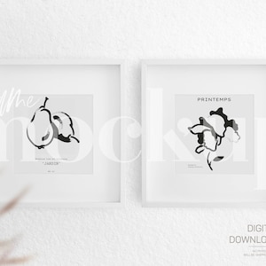 Op de afbeelding: Twee witte ingelijste prints met zwart-wit illustraties. De linker print toont een peer en de tekst "JARDIN". De rechter print toont een bloem en de tekst "PRINTEMPS".