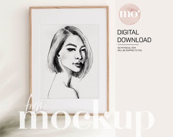 Puede incluir: Una maqueta de descarga digital de una ilustración en blanco y negro de un rostro de mujer enmarcada. El marco es de madera clara y el fondo es blanco.