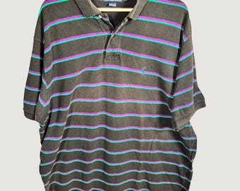 May include: A black short-sleeve polo shirt featuring horizontal stripes in purple and teal. The shirt has a collar, a two-button placket, and a small blue embroidered logo on the left chest. The inner neck label reads Polo by Ralph Lauren XXL.