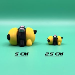 May include: Two 3D printed bee figurines, one yellow and black with silver accents, the other smaller and yellow and black. The larger bee is 5 inches long, the smaller bee is 2.5 inches long.