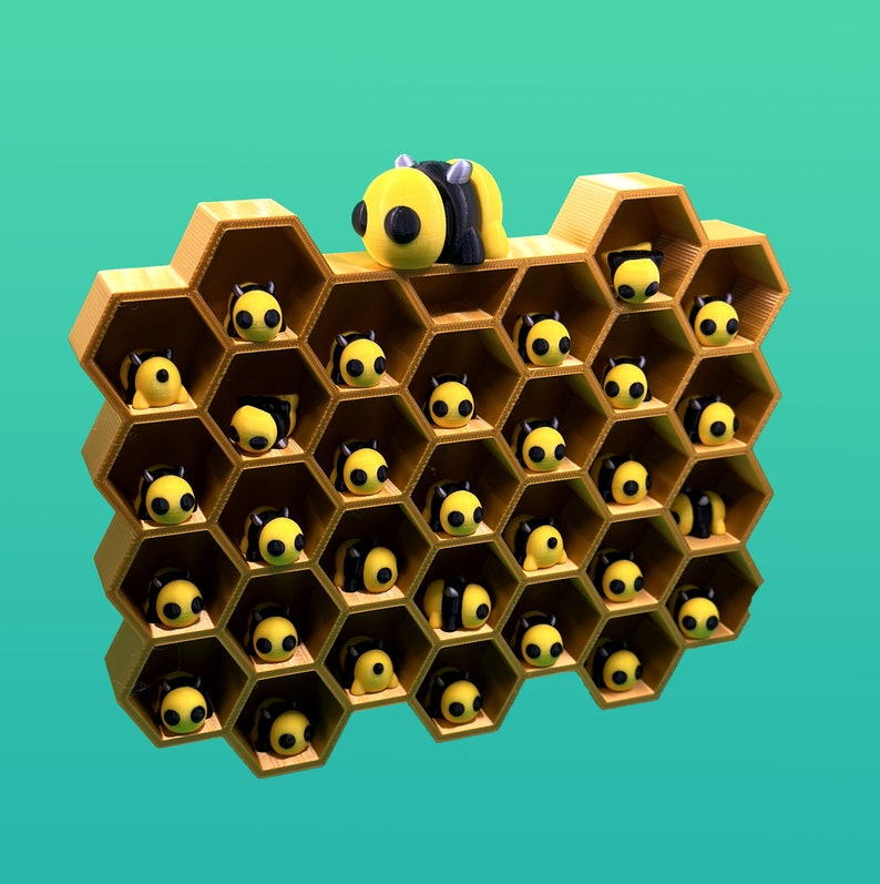 May include: A honeycomb-shaped wall shelf with 25 small bee figurines in each cell. A larger bee figurine is perched on top of the shelf.