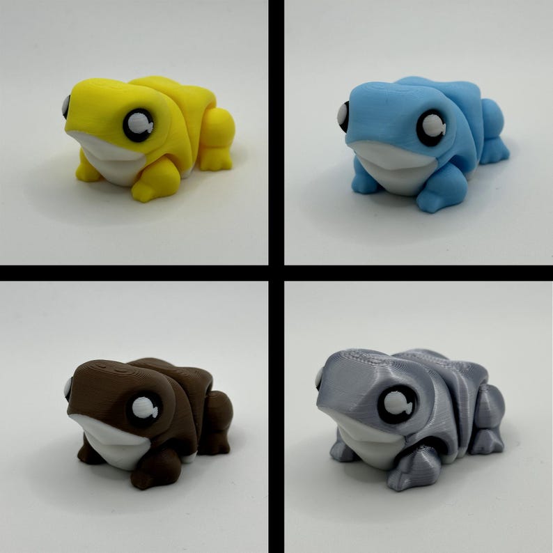 May include: Four frog figurines in yellow, blue, brown, and grey. Each frog has large, round eyes and a white underbelly. The frogs are in a playful, cartoonish style.