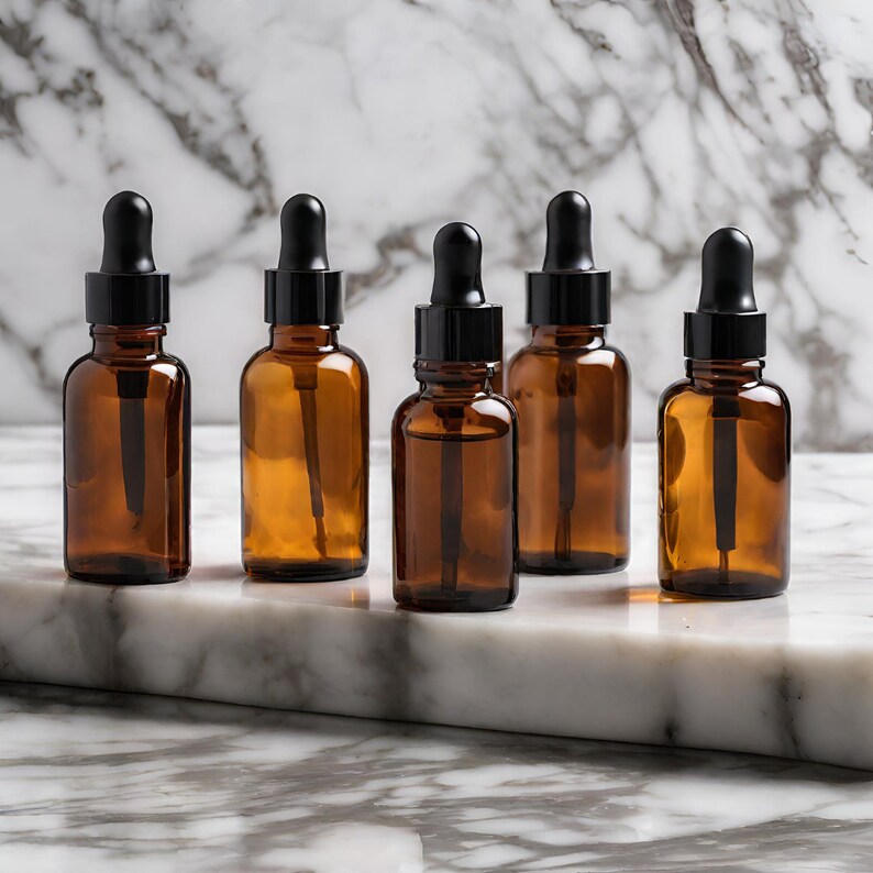 a group of brown glass bottles sitting on top of a marble counter