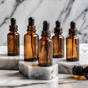 a marble table topped with bottles of essential oils