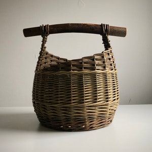 Stick handled mushroom basket