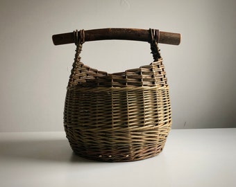Stick handled mushroom basket