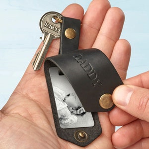 Black leather key chain with the baby picture and the word DADDY embossed on the front