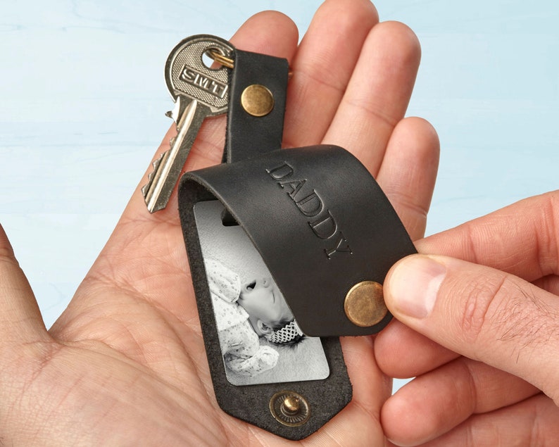 Black leather key chain with the baby picture and the word DADDY embossed on the front