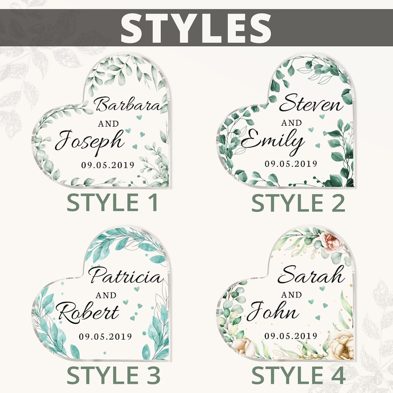 May include: Four different styles of heart-shaped wedding favors with green and white floral designs. Each heart features a couple's names and wedding date. The text on the hearts reads: "Barbara and Joseph 09.05.2019", "Steven and Emily 09.05.2019", "Patricia and Robert 09.05.2019", and "Sarah and John 09.05.2019".