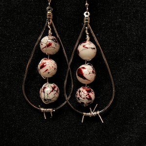 silver toned teardrop punk earrings