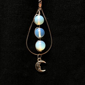 silver toned teardrop earrings with moon accent (two color options)