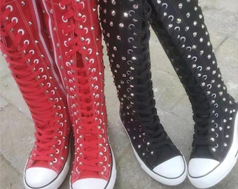 people wearing knee high converse