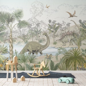 May include: A whimsical nursery wallpaper featuring a green dinosaur in a jungle setting with palm trees, ferns, and a river. The wallpaper has a vintage illustration style and includes a volcano in the background.