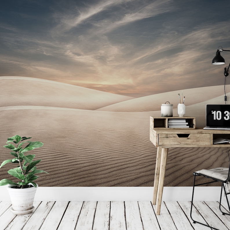 Serene desert sand dunes under a soft, pastel sky in a minimalist landscape wallpaper mural.