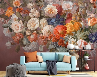 May include: A blue sofa with a throw blanket and pillows in front of a wall mural featuring a large bouquet of colorful flowers.