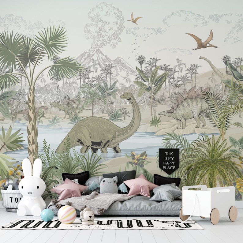 May include: A children's bedroom with a mural featuring a jungle scene with dinosaurs, palm trees, and a volcano. The mural is painted in shades of green, brown, and blue. A gray futon with pillows and a white toy chest are in front of the mural. The text "This is my happy place" is written on a black banner hanging from the ceiling.