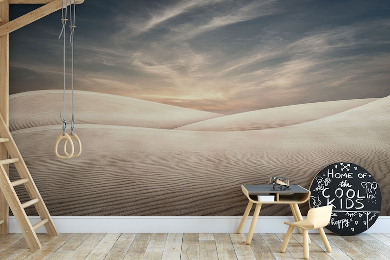 Peaceful sunset over rolling sand dunes captured in a nature-inspired wallpaper mural.