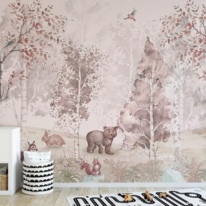 Playful forest scene mural with woodland animals and neutral tones, featuring a bear, rabbit, and delicate pink and brown foliage.