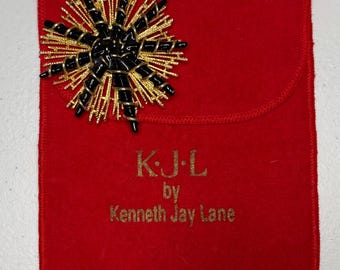 Large KJL by Kenneth Jay Lane brooch: black enamel starburst coral motif