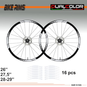 Könnte beinhalten: Zwei schwarze Fahrradreifen mit weißen Akzenten, 26 Zoll, 27,5 Zoll und 28-29 Zoll, mit 16 weißen Felgenaufklebern. BIKE RIMS und DUALCOLOR STAMPE sind im Bild zu sehen.