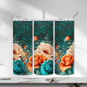 May include: Three stainless steel tumblers with floral designs. The tumblers feature a teal paisley pattern at the top and a vibrant floral arrangement of peach, orange, and teal roses. Each tumbler has a silver straw.