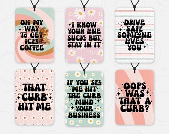 May include: Six colorful car air freshener designs with retro-style text and graphics. The designs include "On my way to get iced coffee", "I know your lane sucks but stay in it", "Drive safe someone loves you", "That curb hit me", "If you see me hit the curb mind your business", and "Oops was that a curb?"