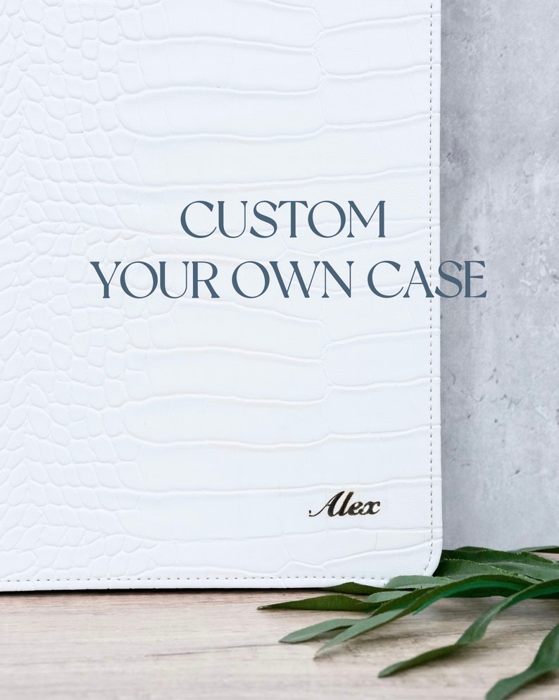 May include: White custom case with the text "CUSTOM YOUR OWN CASE" and the name "Alex" embossed on the front.