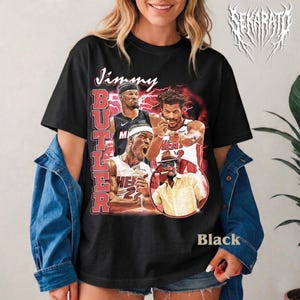 May include: A set of three ceramic mugs with a speckled, matte finish. Each mug features a different color: light blue, cream, and gray. The mugs have a simple, modern design with a rounded shape and a comfortable handle.