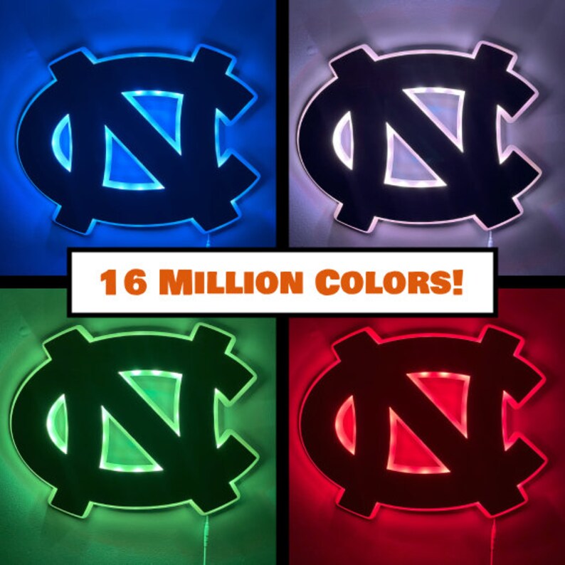 Puede incluir: Un logotipo negro y blanco de los North Carolina Tar Heels con una luz en el interior que se puede cambiar a 16 millones de colores. El logotipo se muestra en azul, blanco, verde y rojo.