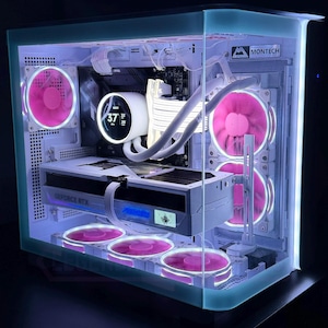 May include: A custom-built computer case with a clear, light blue tinted exterior. The interior features pink LED fans, a white liquid cooler, and a graphics card labeled "GeForce RTX". The temperature display reads 37.