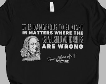 May include: Black t-shirt with a white print of a quote by Voltaire: "It is dangerous to be right in matters where the established authorities are wrong."