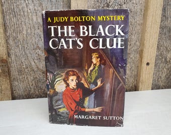 The Black Cat’s Clue: Judy Bolton mystery (Vol. 23)