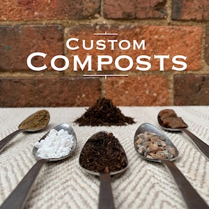 May include: Image showing different compost materials on spoons and a small pile. The text "CUSTOM COMPOSTS" is at the top. The background is a brick wall.