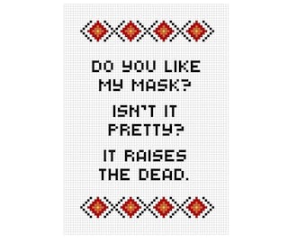 May include: A white background with black text that reads "DO YOU LIKE MY MASK? ISN'T IT PRETTY? IT RAISES THE DEAD."  The text is framed by a red and orange pixelated border.