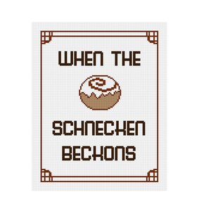 May include: A white background with a brown frame and the text "WHEN THE SCHNECKEN BECKONS" in black. A brown cinnamon roll with white frosting is in the center of the frame.