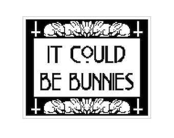 May include: Black and white image of a sign with the text "IT COULD BE BUNNIES" surrounded by a border of crosses and bunnies.