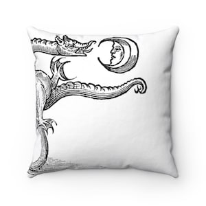 May include: Black and white illustration of a dragon with a crescent moon in its mouth. The dragon is curled around the moon, and its tail is curled up behind it.